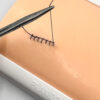 Two-layer skin for suturing