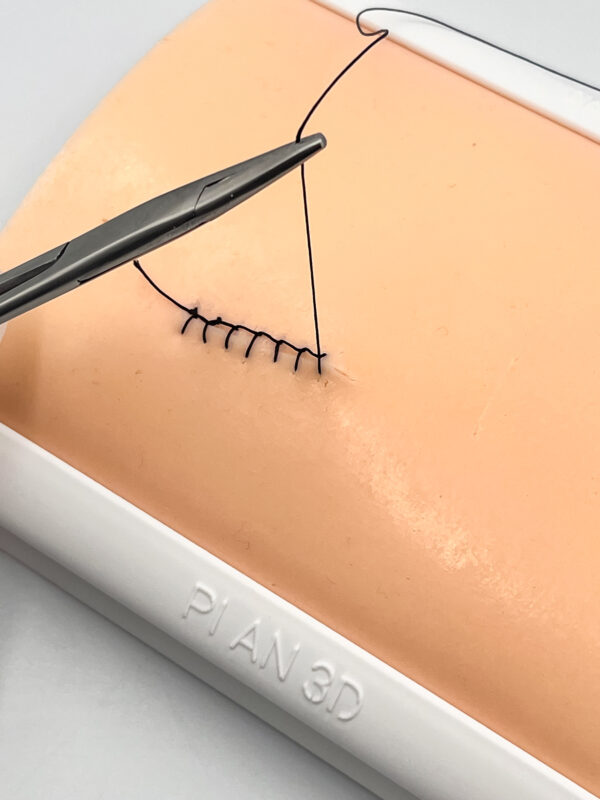 Two-layer skin for suturing