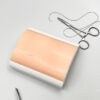 Two-layer skin for suturing