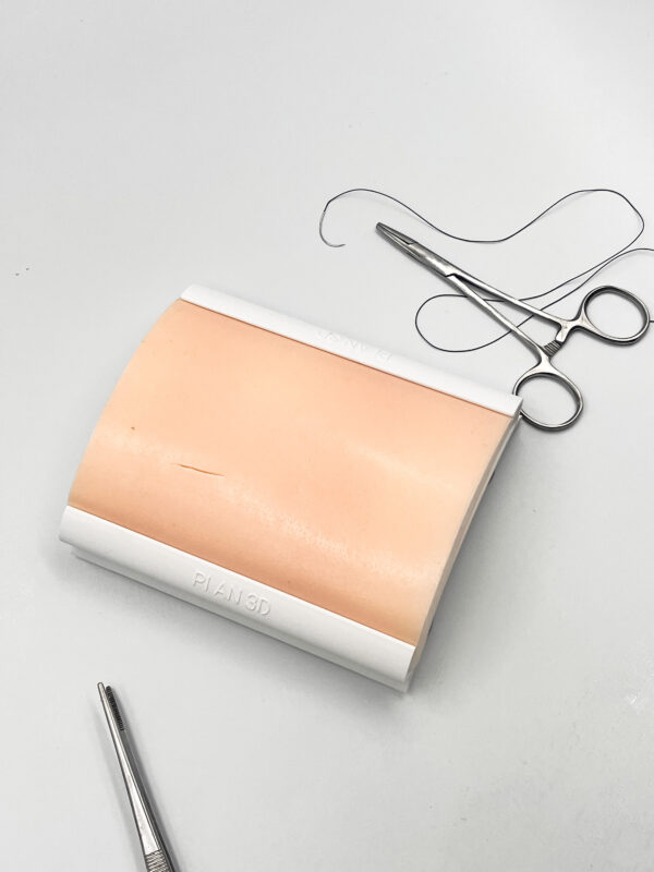 Two-layer skin for suturing