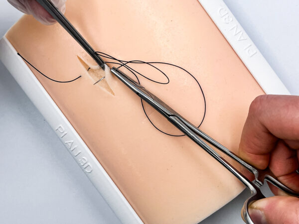 Two-layer skin for suturing