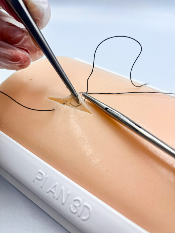 Two-layer skin for suturing
